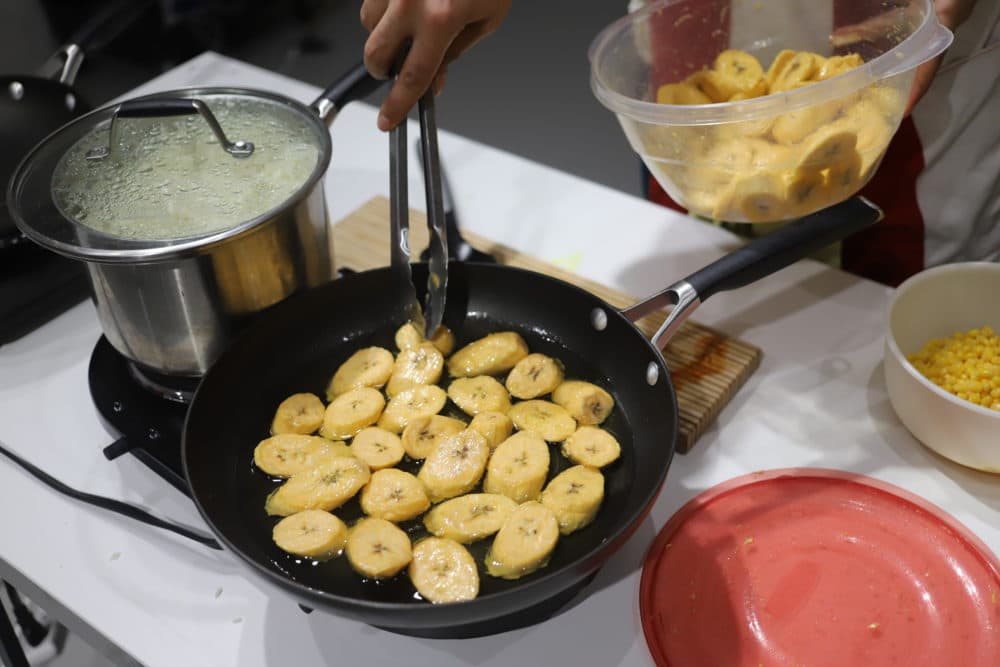 Plantains fried up as Febo and Ricky work on their performance. (Courtesy Carlie Febo)