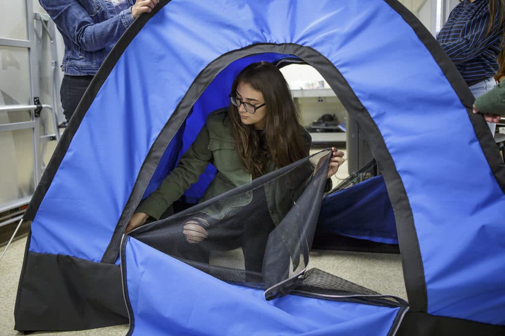 Paulina Martinez zips up the solar-powered tent at San Fernando High School in 2017. (Scott Witter/Redux)