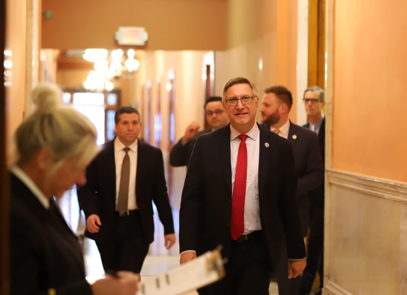 Sen. Michael Rodrigues walked down a Senate corridor Thursday on his way to a caucus where he was announced as new chairman of the budget-writing Ways and Means Committee. (Sam Doran/SHNS)