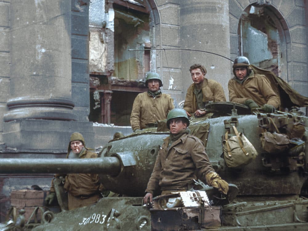 Clarence Smoyer (top middle, no helmet) sits with fellow tank crew members in Cologne, Germany, in 1945. (Courtesy of the National Archives)