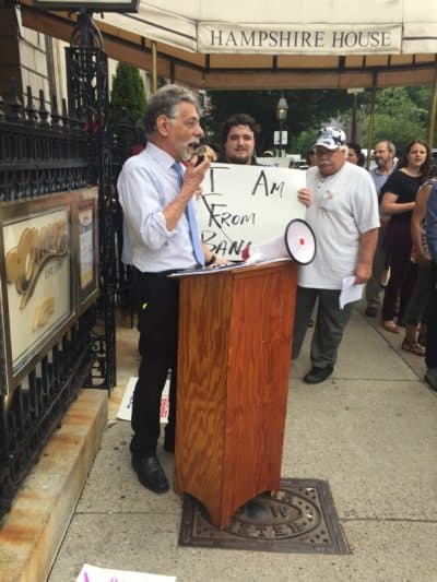 Restuccia speaks at a rally outside of the Hampshire House during a fundraiser for former U.S. Rep. Bruce Poliquin, (R-Maine), the only member of the New England congressional delegation who voted to repeal the Affordable Care Act. (Courtesy Community Catalyst)