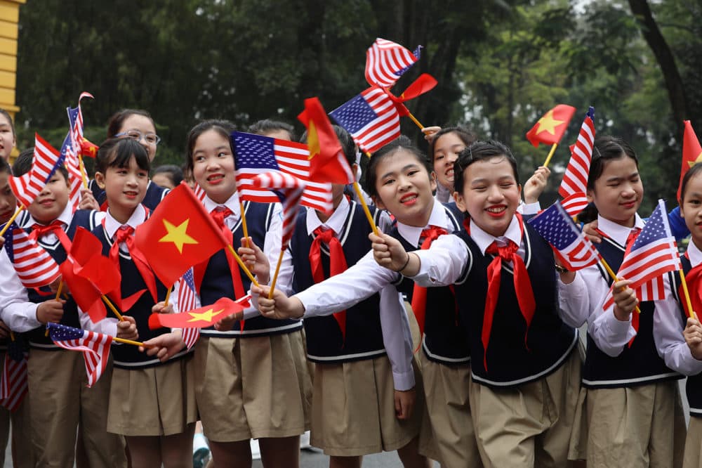 Vietnamese children wave flags before the arrival of President Trump at the Presidential Palace on Feb. 27, 2019 in Hanoi, Vietnam. (Dien Bien/Getty Images)