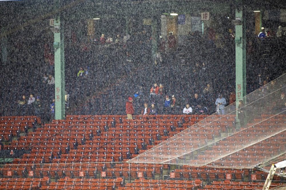 Last year was Massachusetts' rainiest on record. Here, rain falls at Fenway Park before a World Series game. (Jesse Costa/WBUR)