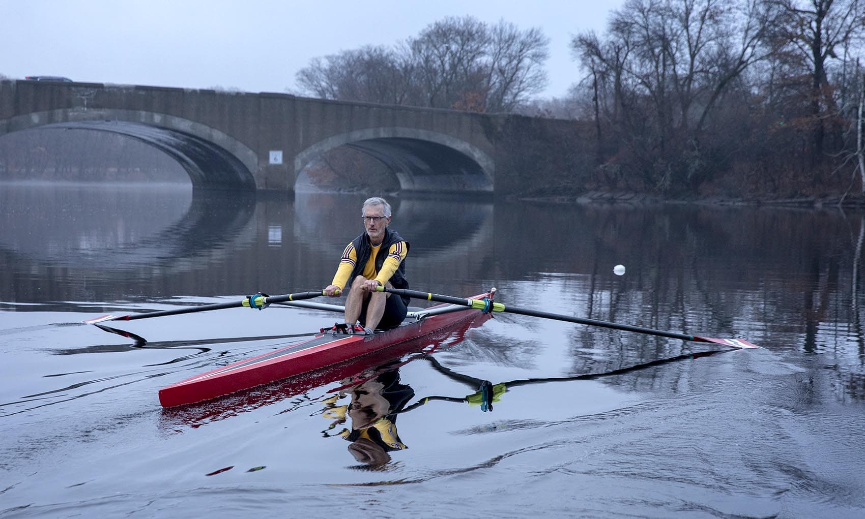 Rower and climate activist Frederick Hewett rows on the Charles River. (Robin Lubbock/WBUR)