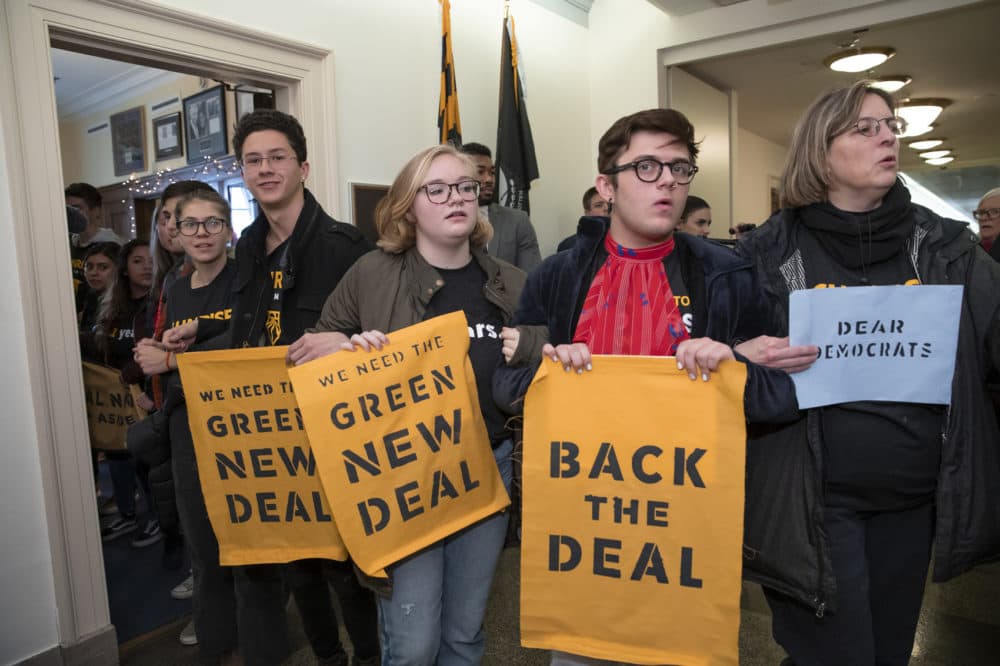 Environmental activists occupy the office of Rep. Steny Hoyer, D-Md., the incoming majority leader, as they try to pressure Democratic support for a sweeping agenda to fight climate change, on Capitol Hill in Washington, Monday, Dec. 10, 2018. (J. Scott Applewhite/AP)