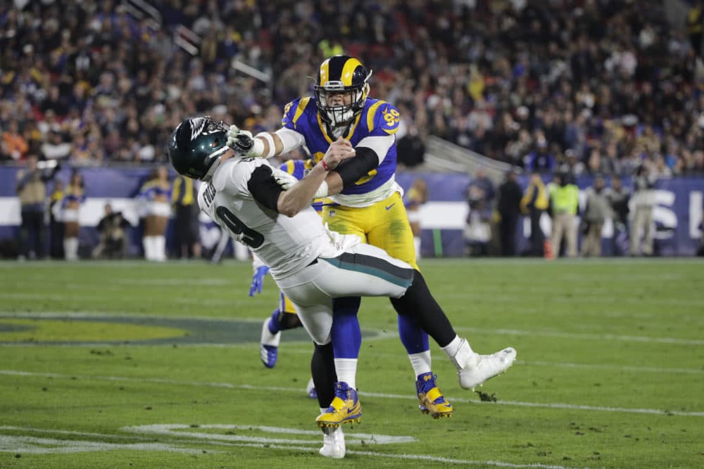 The Rams' Aaron Donald shoves Eagles quarterback Nick Foles during a game Dec. 16. (Jae C. Hong/AP)