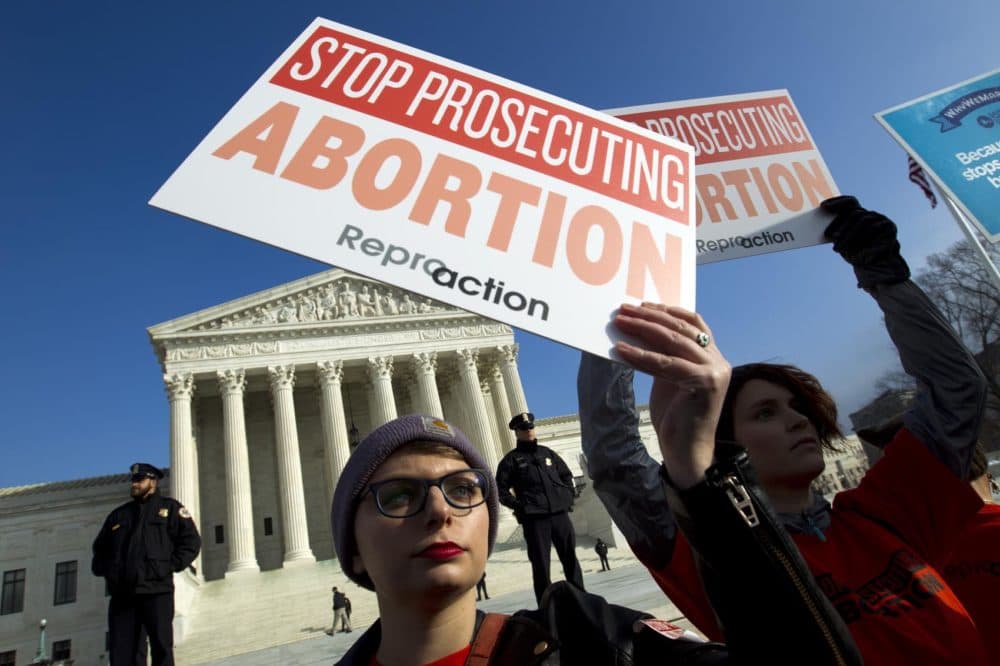 Abortion rights activists protest outside of the U.S. Supreme Court, during the March for Life in Washington, Friday, Jan. 18, 2019. (Jose Luis Magana/AP)
