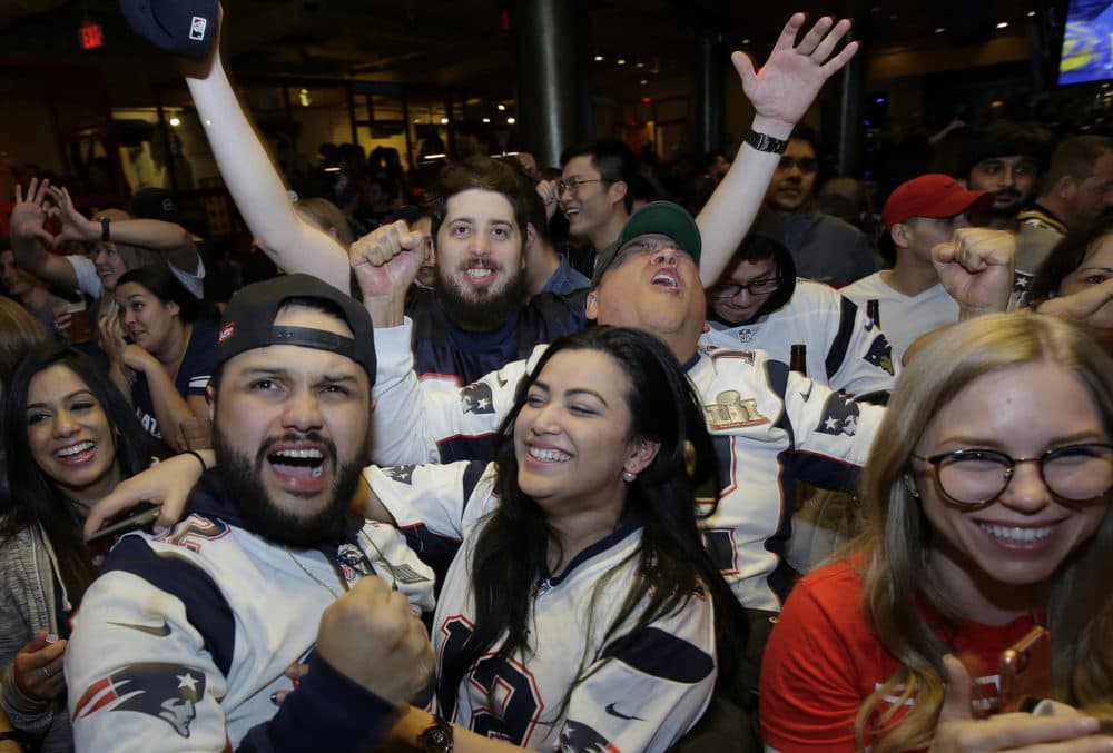 Patriots fans cheer. (Steven Senne/AP)