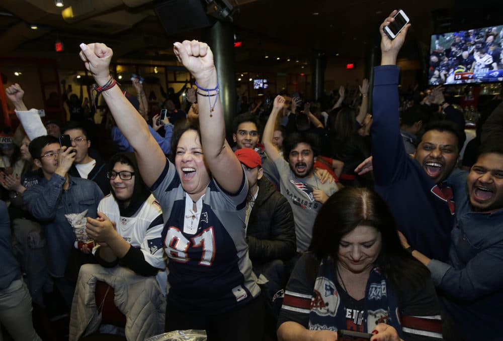 New England Patriots fans celebrate after the Patriots defeated the Los Angeles Rams in the NFL Super Bowl 53 football game in Atlanta at a bar in Boston on Sunday, Feb. 3, 2019. (Steven Senne/AP)