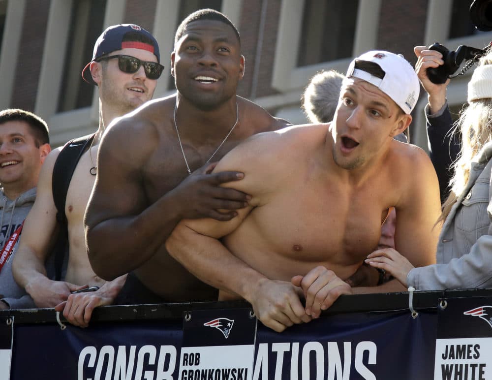 Tight ends Dwayne Allen, left, and Rob Gronkowski react to fans. (Elise Amendola/AP)