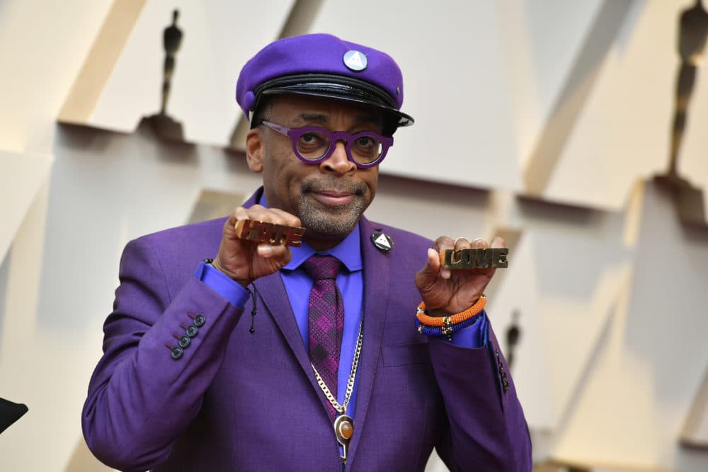 Spike Lee holds up brass knuckles reading &quot;hate&quot; and &quot;love&quot; from his iconic film &quot;Do The Right Thing.&quot; (Jordan Strauss/Invision/AP)