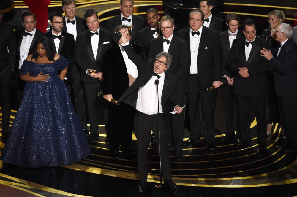 Peter Farrelly, center, and the cast and crew of &quot;Green Book&quot; accept the award for best picture. (Chris Pizzello/Invision/AP)