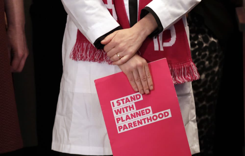 Dr. Erin Berry, of Planned Parenthood, listens at a news conference announcing a lawsuit challenging the Trump administration's Title X &quot;gag rule&quot; Monday, Feb. 25, 2019, in Seattle. (Elaine Thompson/AP)