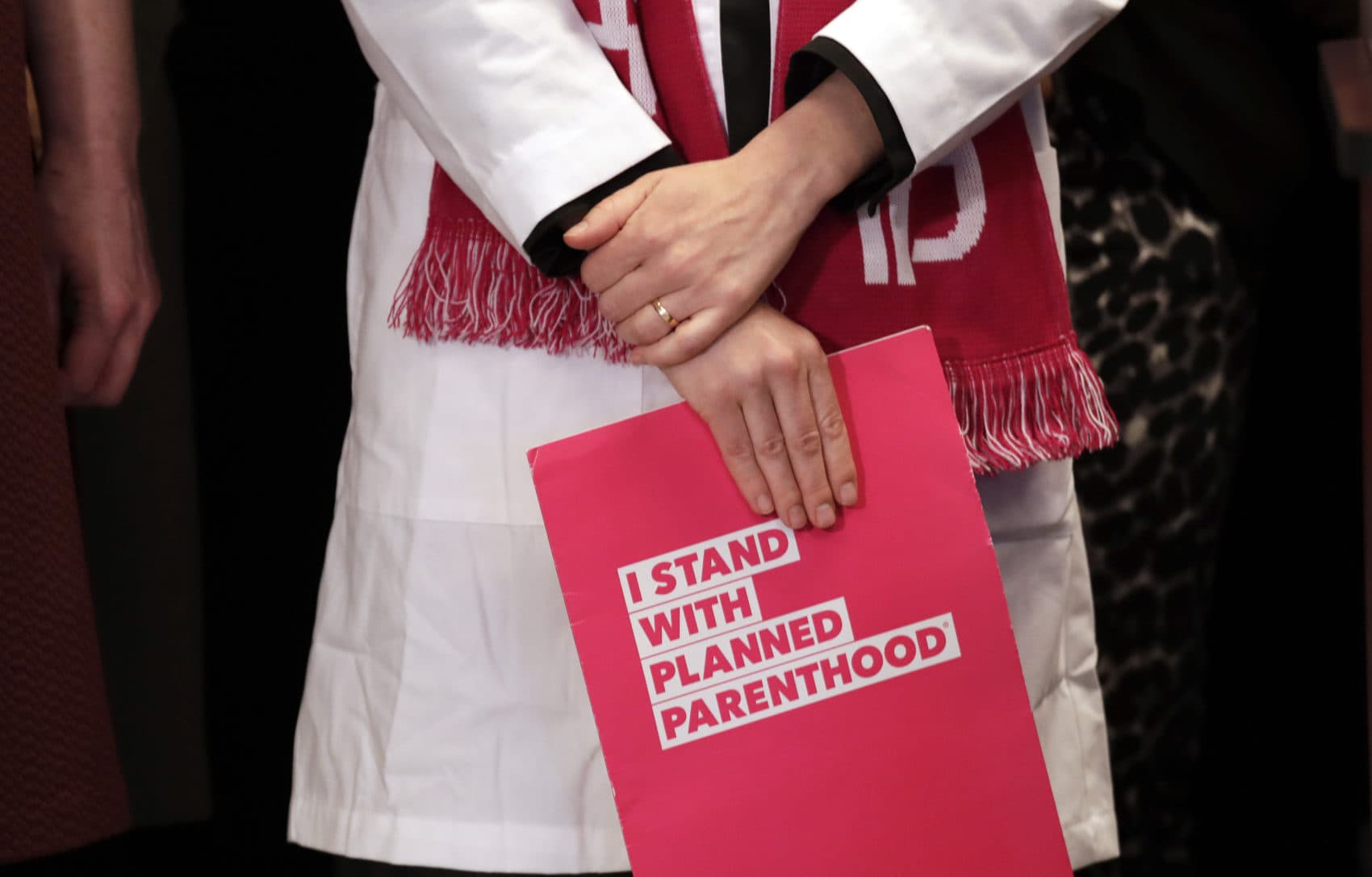 Dr. Erin Berry, of Planned Parenthood, listens at a news conference announcing a lawsuit challenging the Trump administration's Title X "gag rule" Monday, Feb. 25, 2019, in Seattle. (Elaine Thompson/AP)