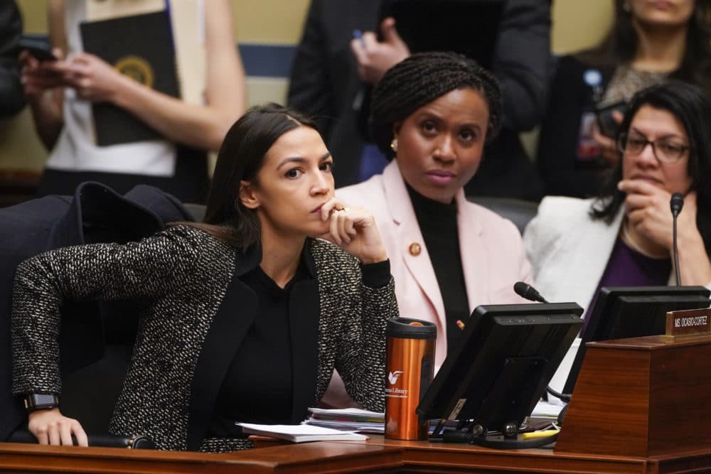 House Oversight and Reform Committee members, from left, Rep. Alexandria Ocasio-Cortez, D-N.Y., Rep. Ayanna Pressley, D-Mass., and Rep. Rashida Tlaib, D-Mich., listen during a committee hearing Tuesday. (J. Scott Applewhite/AP)