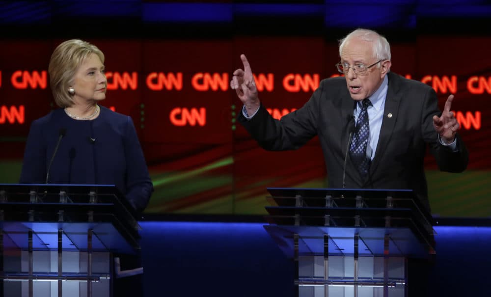 Sen. Bernie Sanders, I-Vt., right, argues a point as Hillary Clinton listens during a Democratic presidential primary debate at the University of Michigan-Flint, Sunday, March 6, 2016. (AP/Carlos Osorio)