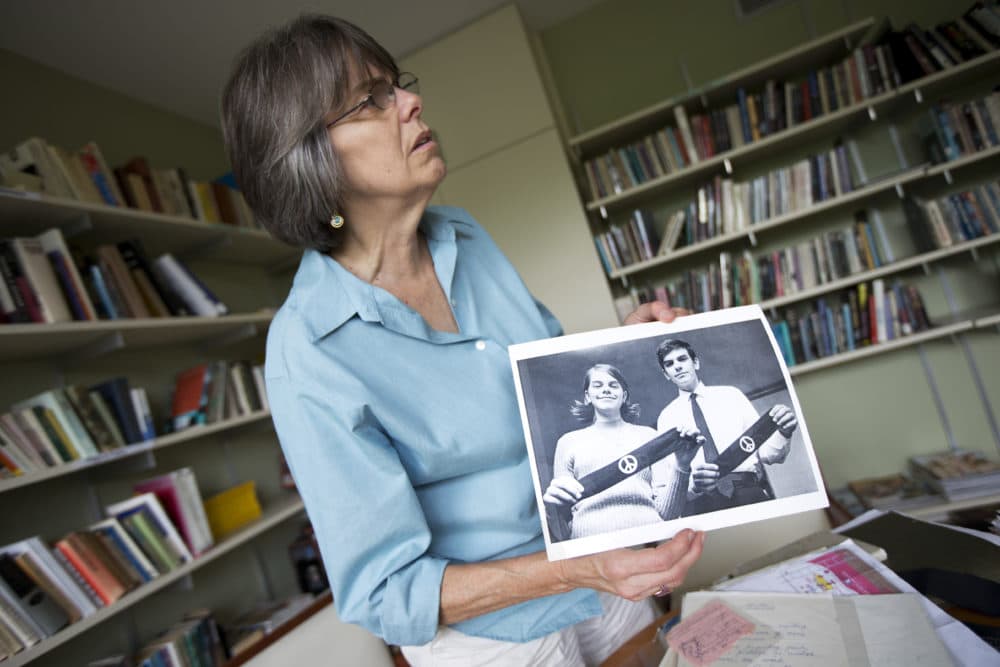 In this photo taken Tuesday, Aug. 27, 2013, Mary Beth Tinker shows a photograph during an interview in Washington. Tinker was just 13 when she spoke out against the Vietnam War by wearing a black armband to her Iowa school in 1965. When the school suspended her, she took her free speech case all the way to the U.S. Supreme Court and won. Her message: Students should take action on issues important to them. "It's better for our whole society when kids have a voice," she says. (Manuel Balce Ceneta/AP)