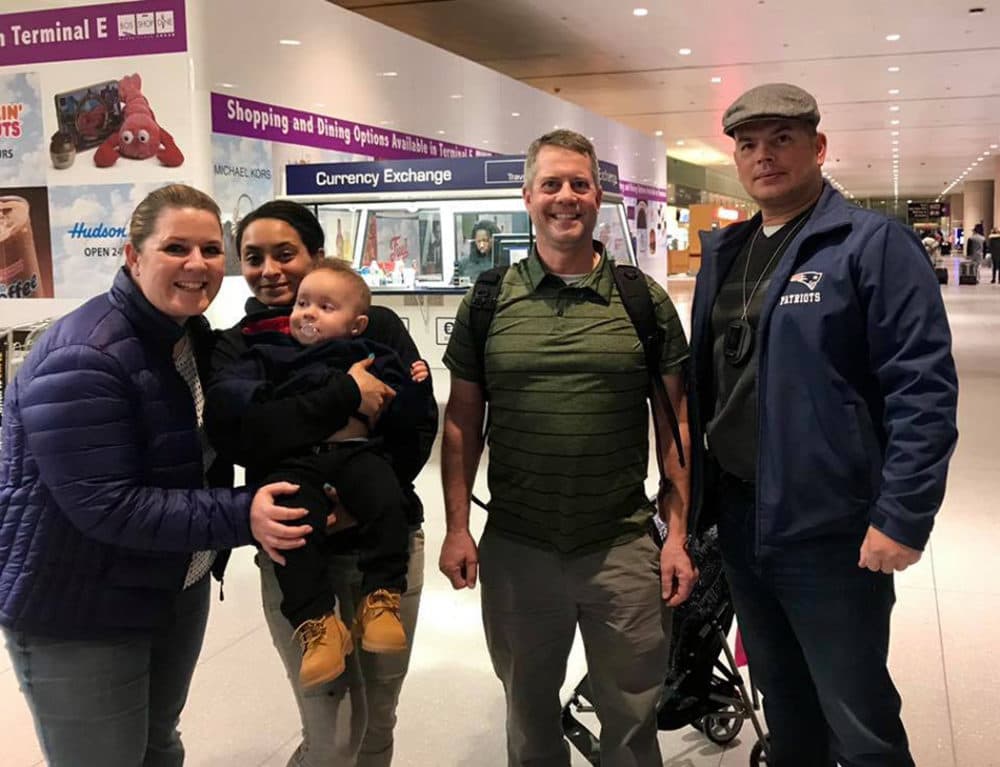 Mahalia Alexander-Paggi is reunited with her 14-month-old son at Logan International Airport in Boston on Sunday, Feb. 17, 2019. (Courtesy Lowell Police Department)