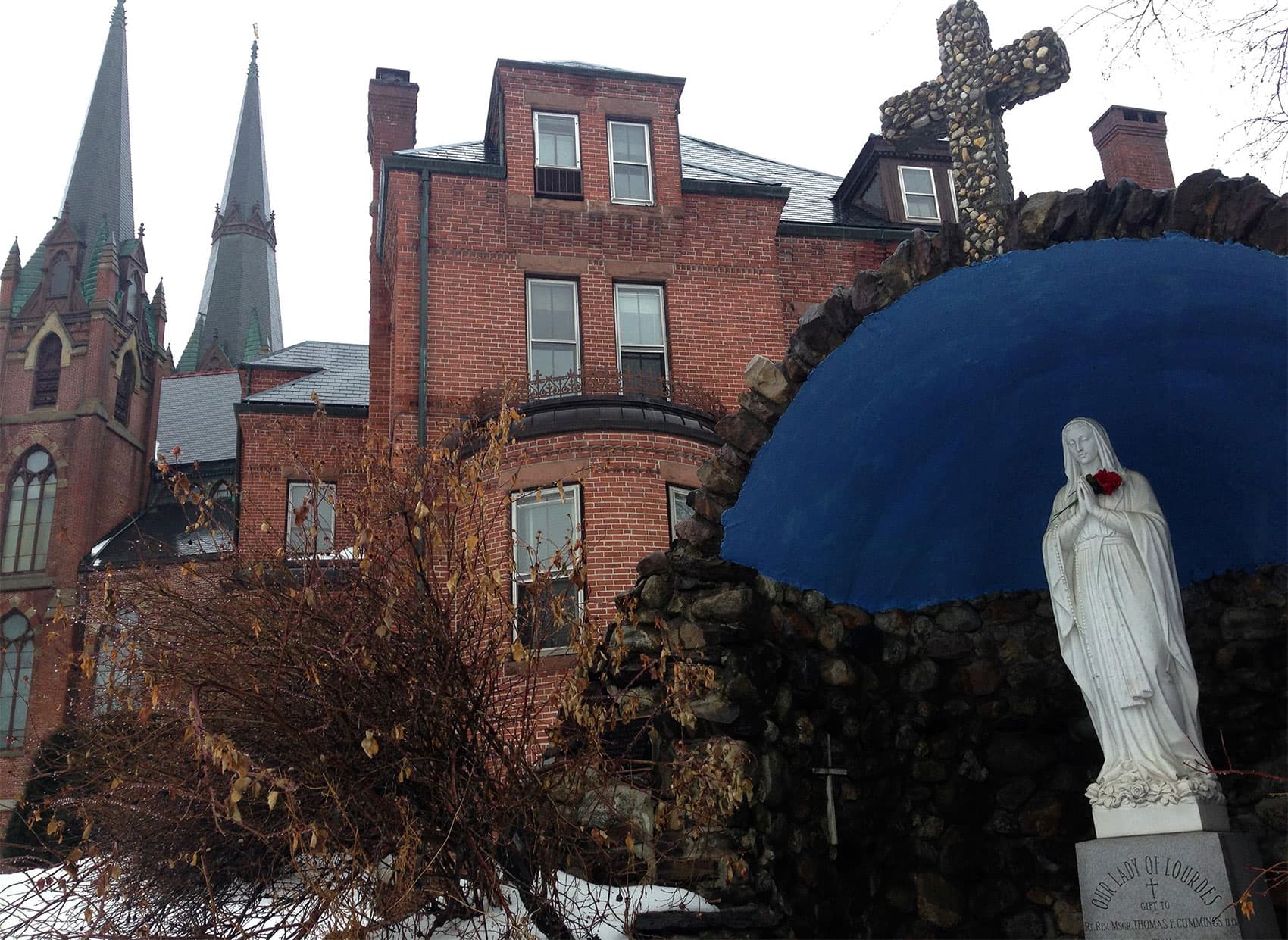 The now-closed St. Mary's Church in Northampton, Massachusetts. Richard Koske says he was sexually assaulted by a priest in the rectory, at center. (Nancy Eve Cohen/NEPR)