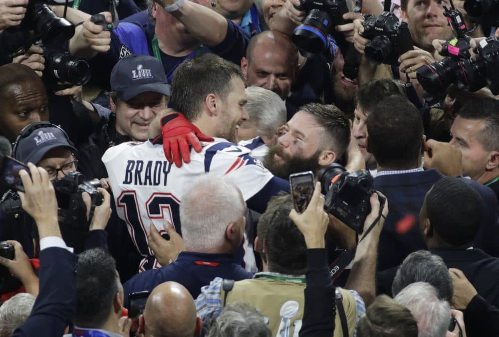 New England Patriots' Julian Edelman, right, and teammate Tom Brady celebrate after the Super Bowl. (Charlie Riedel/AP)