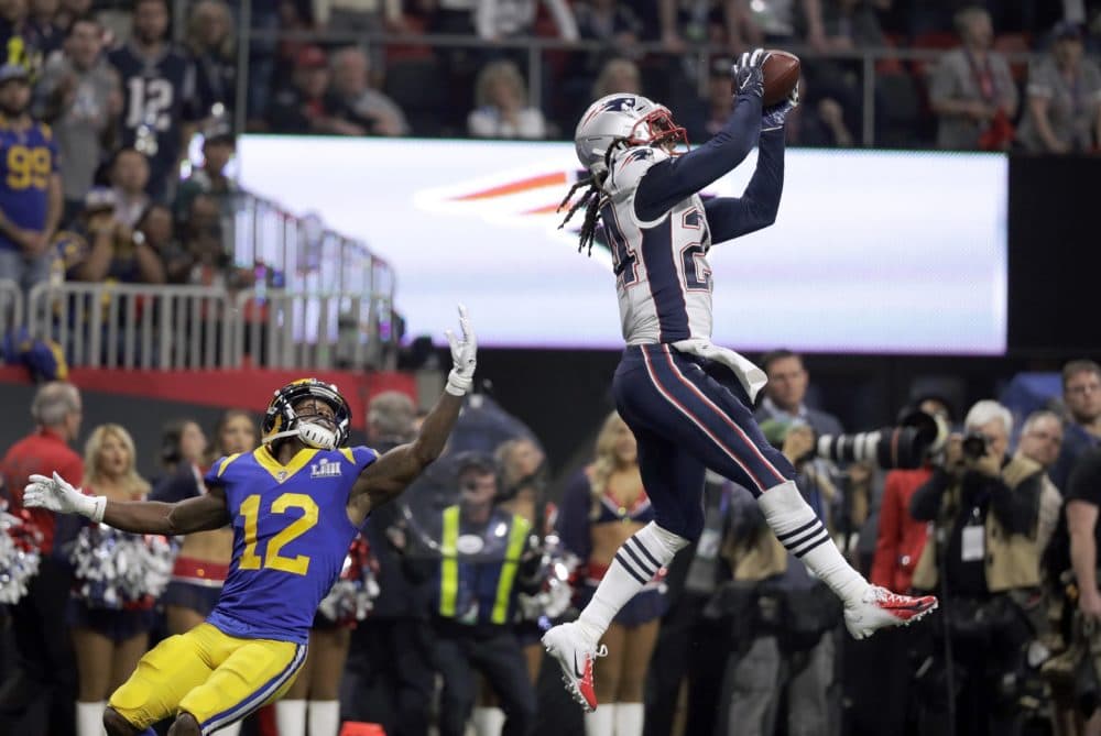 New England Patriots' Stephon Gilmore, right, intercepts a pass intended for Los Angeles Rams' Brandin Cooks (12) during the second half of the NFL Super Bowl LIII football game. (Chuck Burton/AP)