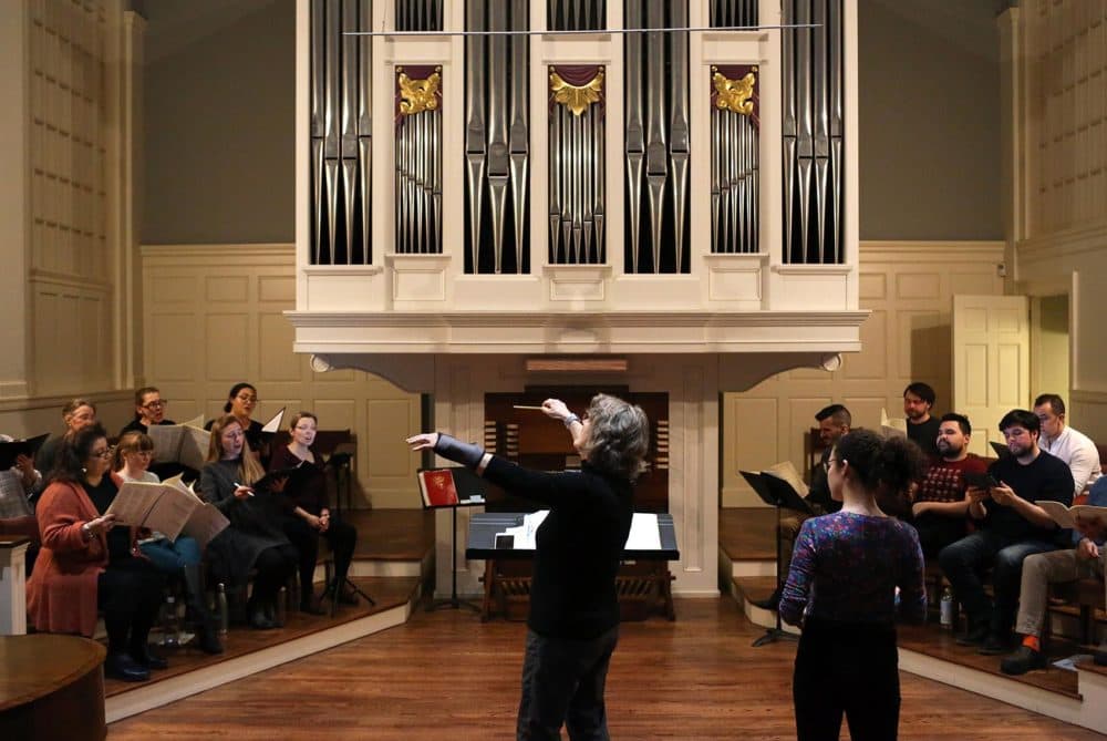 The Cappella Clausura practices for upcoming performances of Fanny Mendelssohn Hensel's 3 cantatas at the Eliot Church in Newton. (Hadley Green for WBUR)