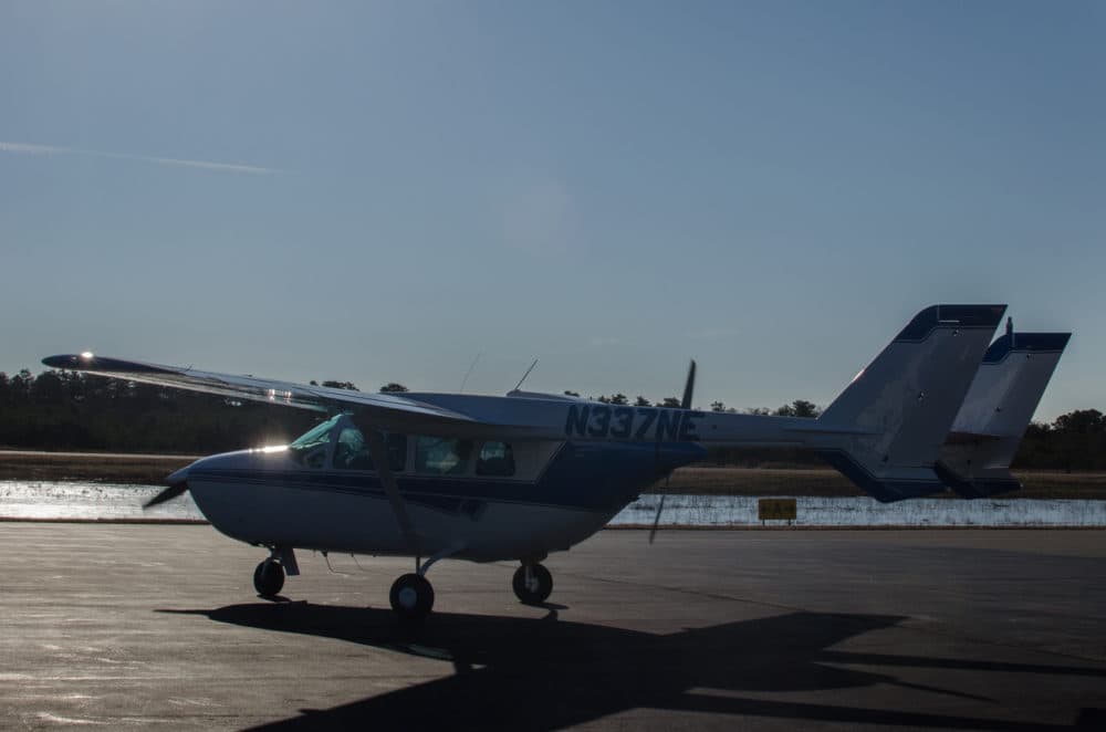 The aerial surveillance team conducts surveys in a tiny Cessna 337 0-2 Skymaster (Sharon Brody/WBUR)