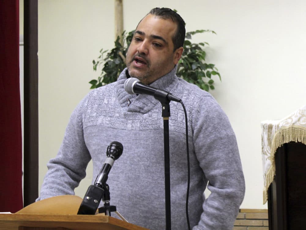 Small business owner Junior Hernandez speaks during a community forum at Capilla Evangelica Hispana, on Wednesday in Lawrence, Mass., to discuss the natural gas explosions that rocked the city last Sept. 13. (Philip Marcelo/AP)