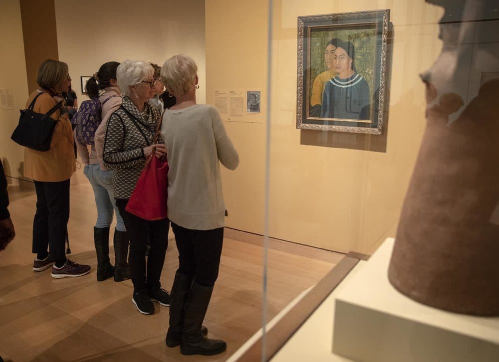 Visitors at the MFA Boston look at Frida Kahlo's &quot;Dos Mujeres.&quot; (Robin Lubbock/WBUR)
