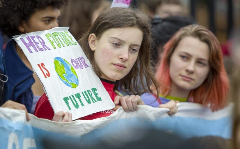 Many of the students from the Northampton High School Environmental Club who joined the protests came ready with signs. (Robin Lubbock/WBUR)