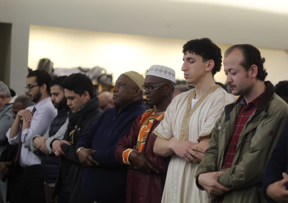 Worshipers gather inside the Islamic Society of Boston Cultural Center on Friday. (Quincy Walters/WBUR)