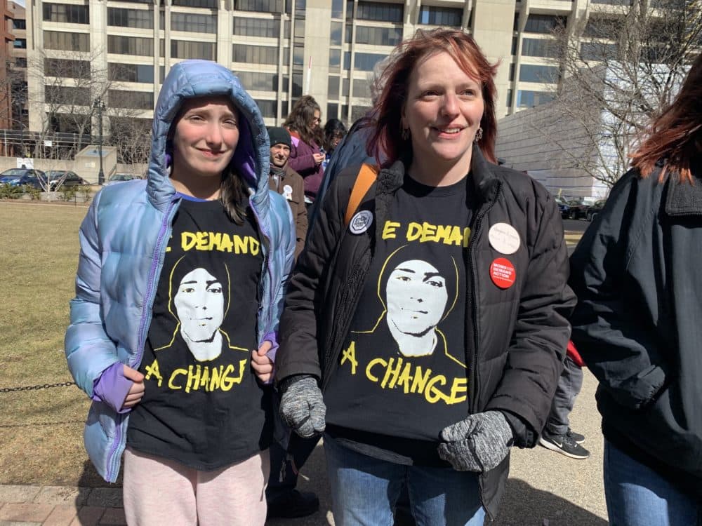Samantha McGarry, of Framingham, and her 11-year-old daughter wear shirts featuring the face of 17-year-old Joaquin Oliver, a student who was killed in the Parkland shooting. (Simón Rios/WBUR)