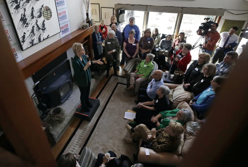 Democratic presidential candidate Sen. Elizabeth Warren, D-Mass., left, speaks at a campaign house party on March 15 in Salem, N.H. (Elise Amendola/AP)