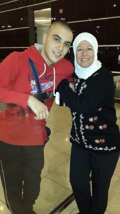 Omar Zarzour hugs his mom goodbye at an airport in Jordan. (Courtesy Omar Zarzour)