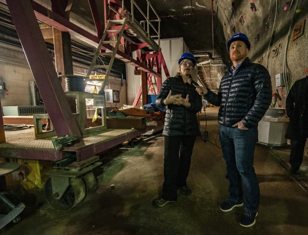 Fermilab's Bonnie Fleming (left) speaking with Here &amp; Now's Jeremy Hobson 300 feet underground. (Chris Bentley/Here &amp; Now)