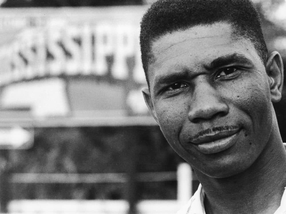 Medgar Evers, civil rights activist and the NAACP's first field secretary, stands near a sign of the state of Mississippi in 1958. (Francis H. Mitchell - Ebony Collection/AP)