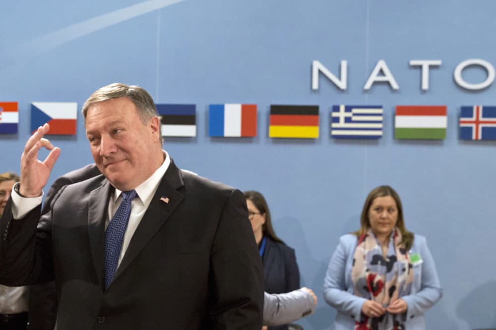 U.S. Secretary of State Mike Pompeo, left, waits for the start of the North Atlantic Council at NATO headquarters in Brussels on Friday, April 27, 2018. (Virginia Mayo/AP)