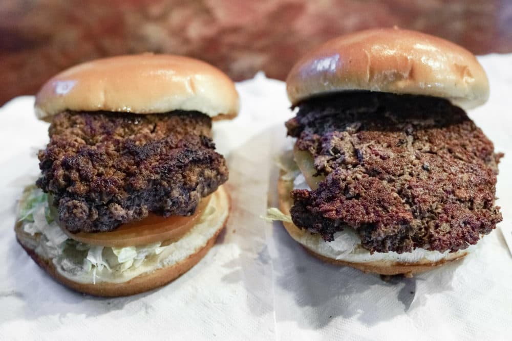 On the left, a conventional beef burger. On the right, &quot;The Impossible Burger,&quot; a plant-based burger containing wheat protein, coconut oil and potato protein among. (Nati Harnik/AP)
