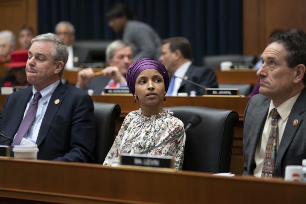 Rep. Ilhan Omar, D-Minn., sits with fellow Democrats, Rep. David Trone, D-Md., left, and Rep. Andy Levin, D-Mich., right, on the House Education and Labor Committee during a bill markup, on Capitol Hill in Washington, Wednesday, March 6, 2019. (J. Scott Applewhite/AP)