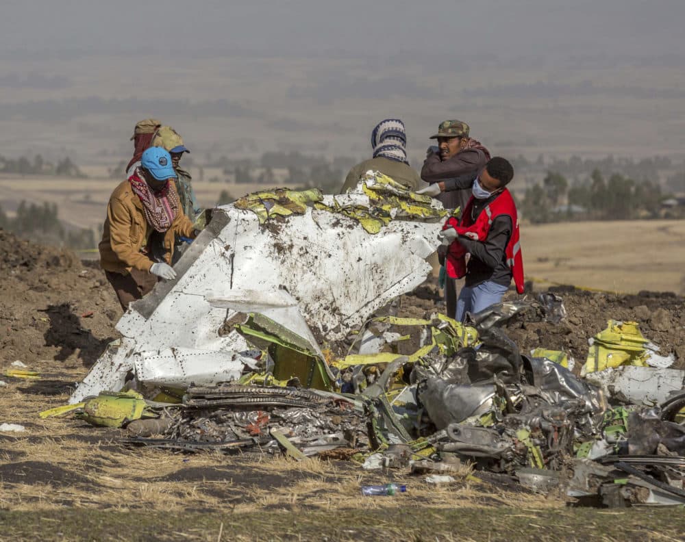 Rescuers work at the scene of an Ethiopian Airlines flight crash near Bishoftu, or Debre Zeit, south of Addis Ababa,  Ethiopia, Monday, March 11, 2019. (Mulugeta Ayene/AP)