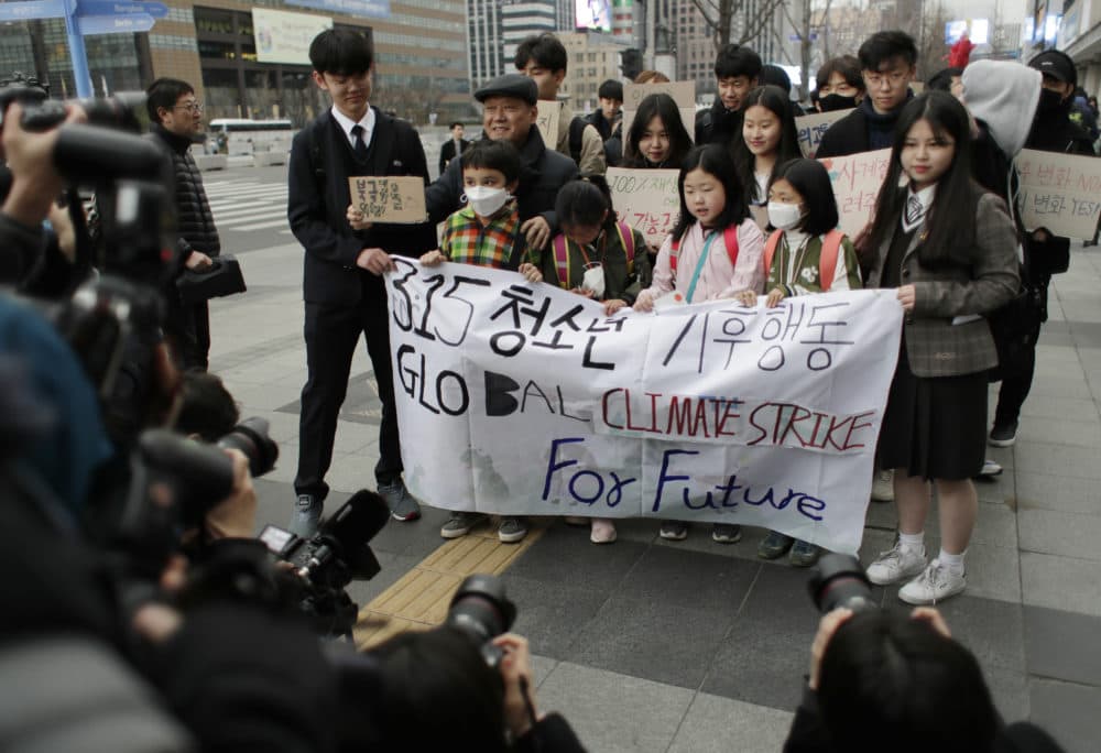 Participants march in Seoul, South Korea, Friday, March 15, 2019. About 150 students and other protesters attended a rally to protest their governments' failure to take sufficient action against climate change. (Lee Jin-man/AP)