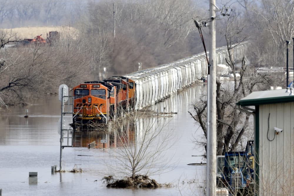 A train sits in flood waters from the Platte River, in Plattsmouth, Neb., on Sunday, March 17, 2019. Hundreds of people remained evacuated from their homes in Nebraska. (Nati Harnik/AP)