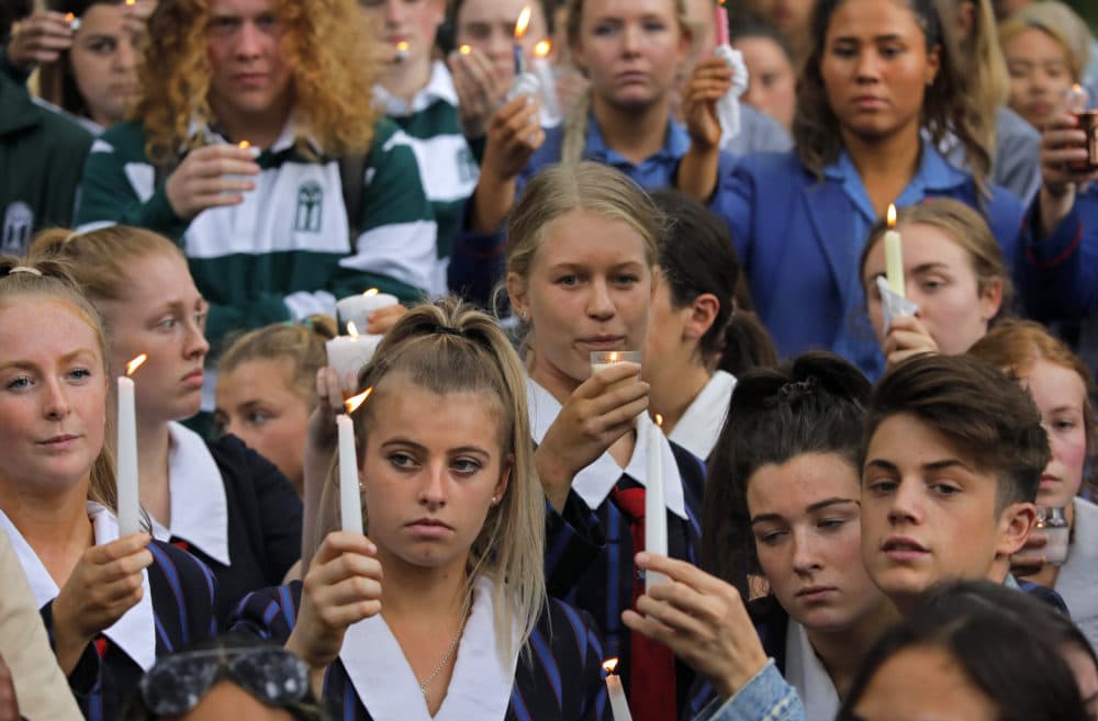 Students raise candles during a vigil outside the Al Noor mosque in Christchurch, New Zealand, on Monday, March 18, 2019. TAP Photo/Vincent Yu)