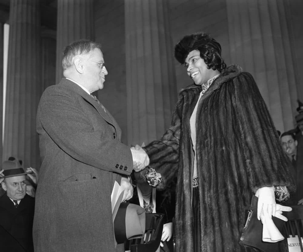 Marian Anderson, right, is shown with Secretary of Interior Harold Ickes before he introduced her to a crowd of 75,000 people on the steps of the Lincoln Memorial on April 9, 1939. (AP)