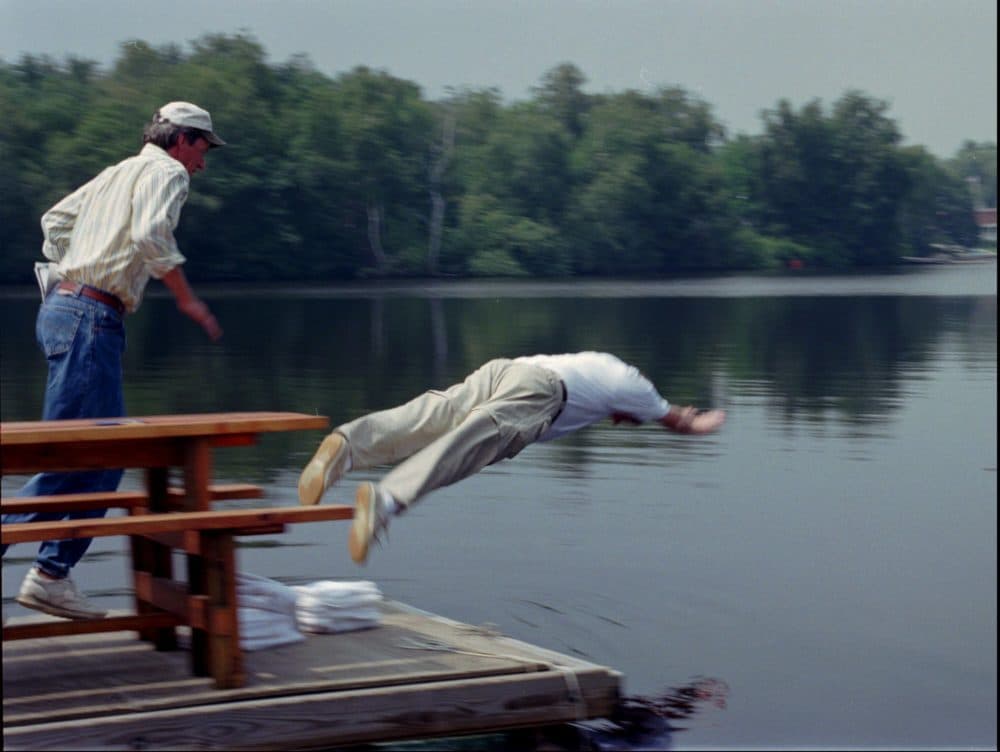 Massachusetts Gov. William Weld takes an unannounced dive into the Charles River on Wednesday, Aug. 7, 1996. (Gail Oskin/AP)