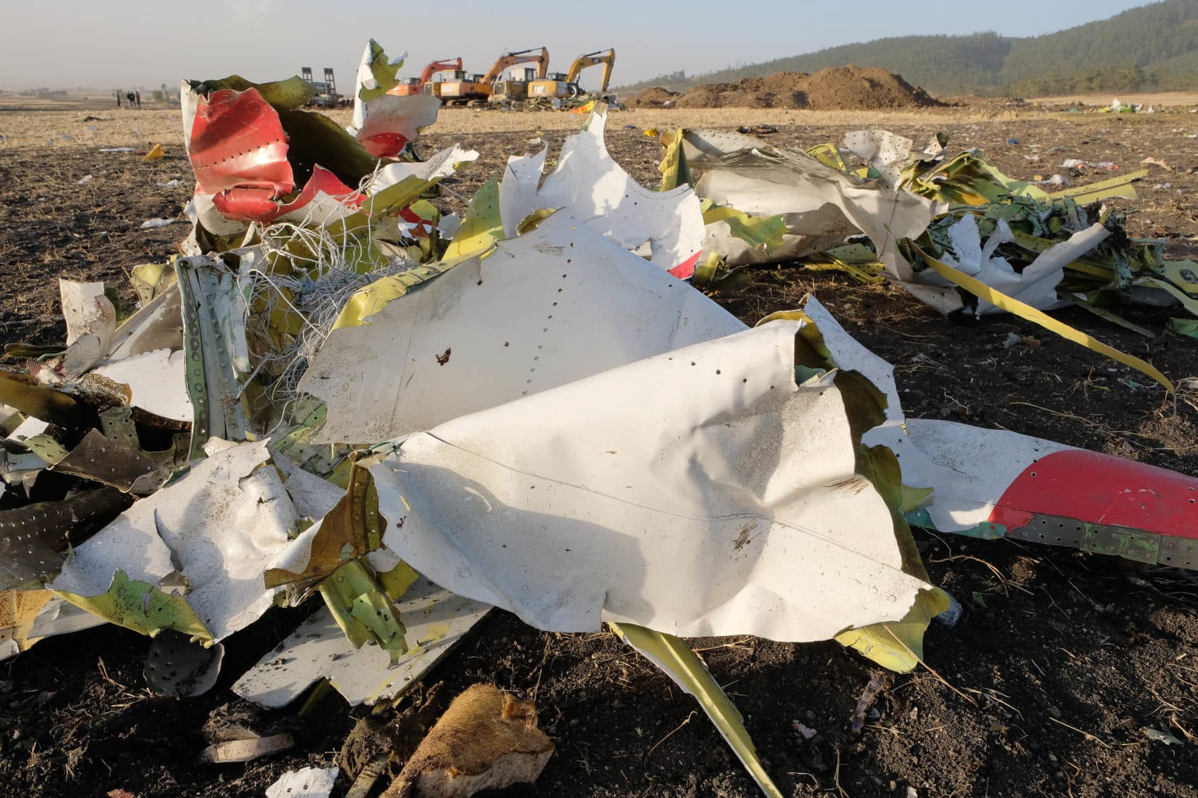 Debris lays piled up just outside the impact crater after being gathered by workers during the continuing recovery efforts at the crash site of the Ethiopian Airlines flight on March 11, 2019 in Bishoftu, Ethiopia. (Jemal Countess/Getty Images)