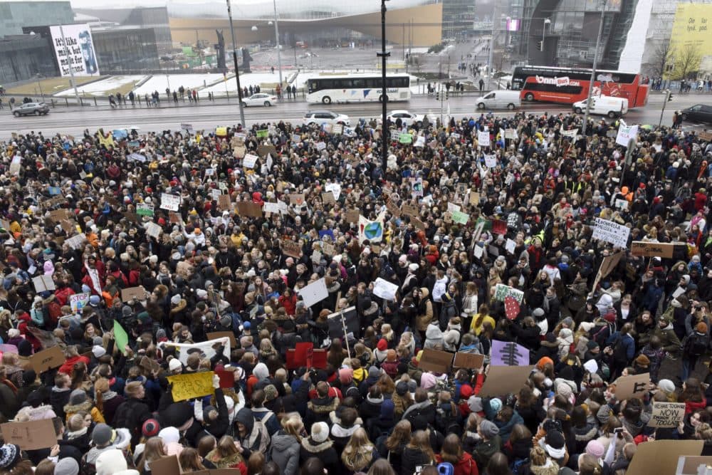 Young demonstrators in Finland gather at the Finnish Parliament during the protest march of Finnish youths calling for climate protection in Helsinki, on March 15, 2019. (Heikki Saukkomaa/AFP/Getty Images)