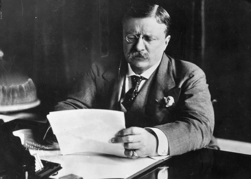 Theodore Roosevelt, the 26th president of the United States, sitting at his desk working. (Hulton Archive/Getty Images)