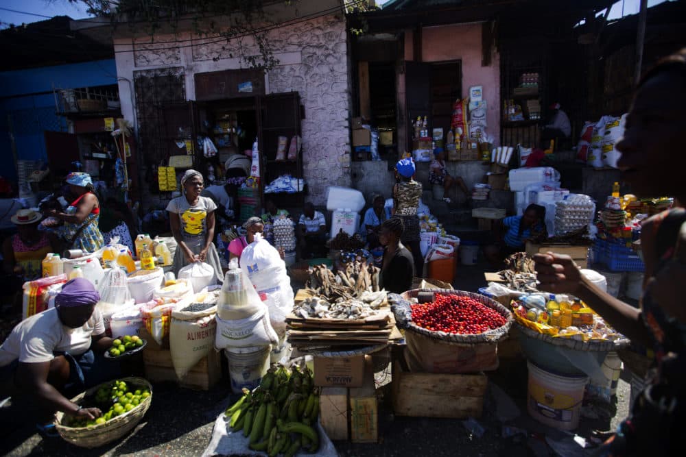 Vendors wait for clients at an open-air market in Port-au-Prince, Haiti, on Feb. 18, 2019, when businesses and government offices slowly reopened across Haiti after more than a week of demonstrations. (Dieu Nalio Chery/AP)