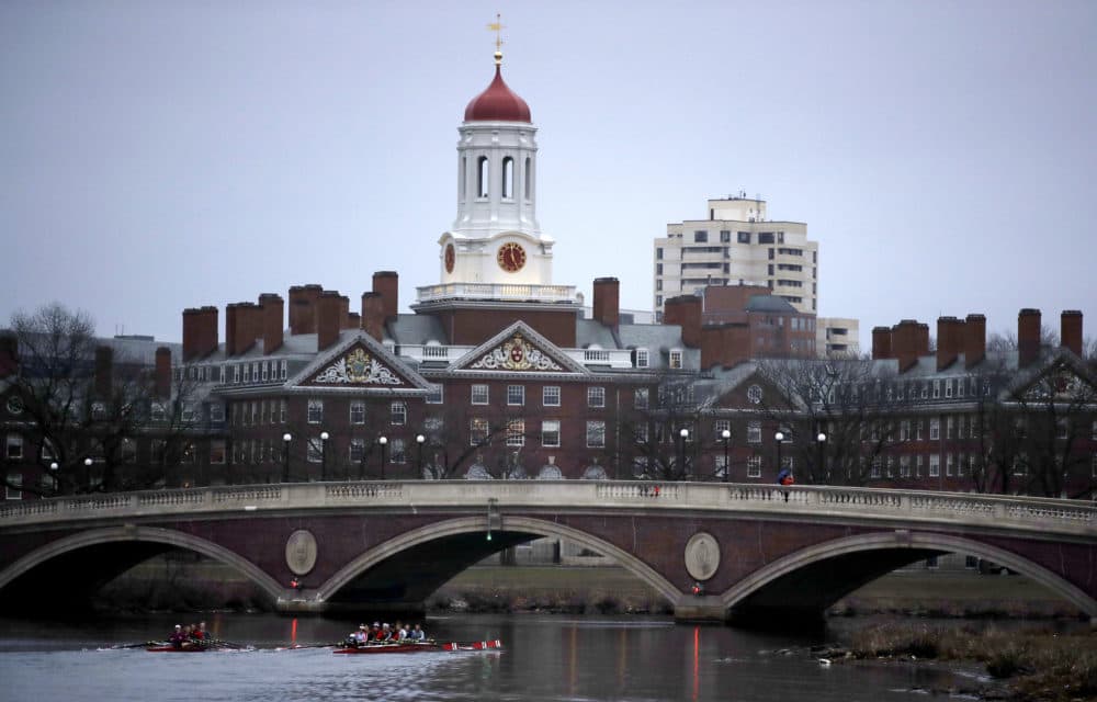 In this March 7, 2017 file photo, rowers paddle down the Charles River past the campus of Harvard University in Cambridge, Mass. Monday, Oct. 15, 2018. (Charles Krupa/AP)
